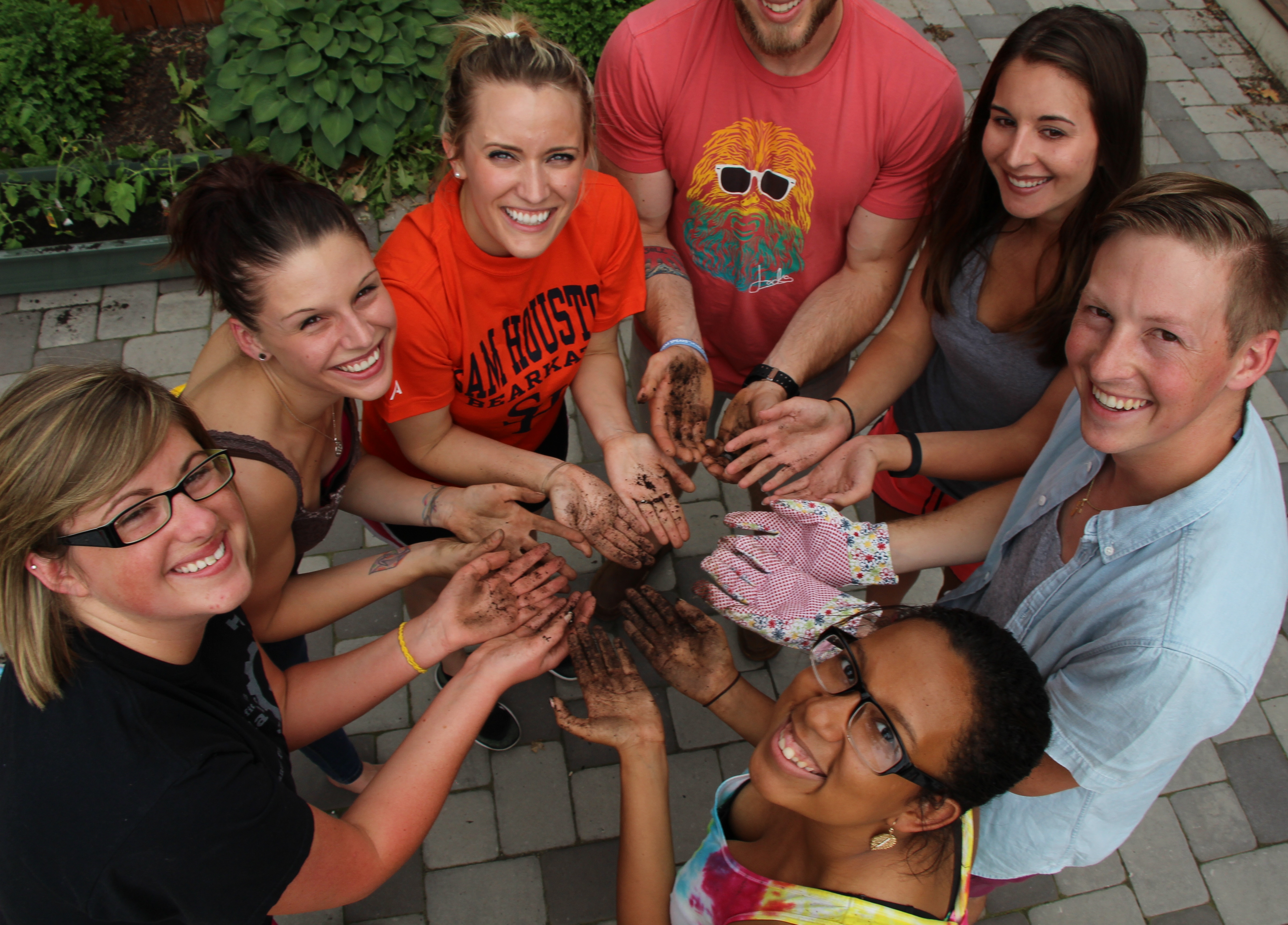 employees with dirty hands from gardening